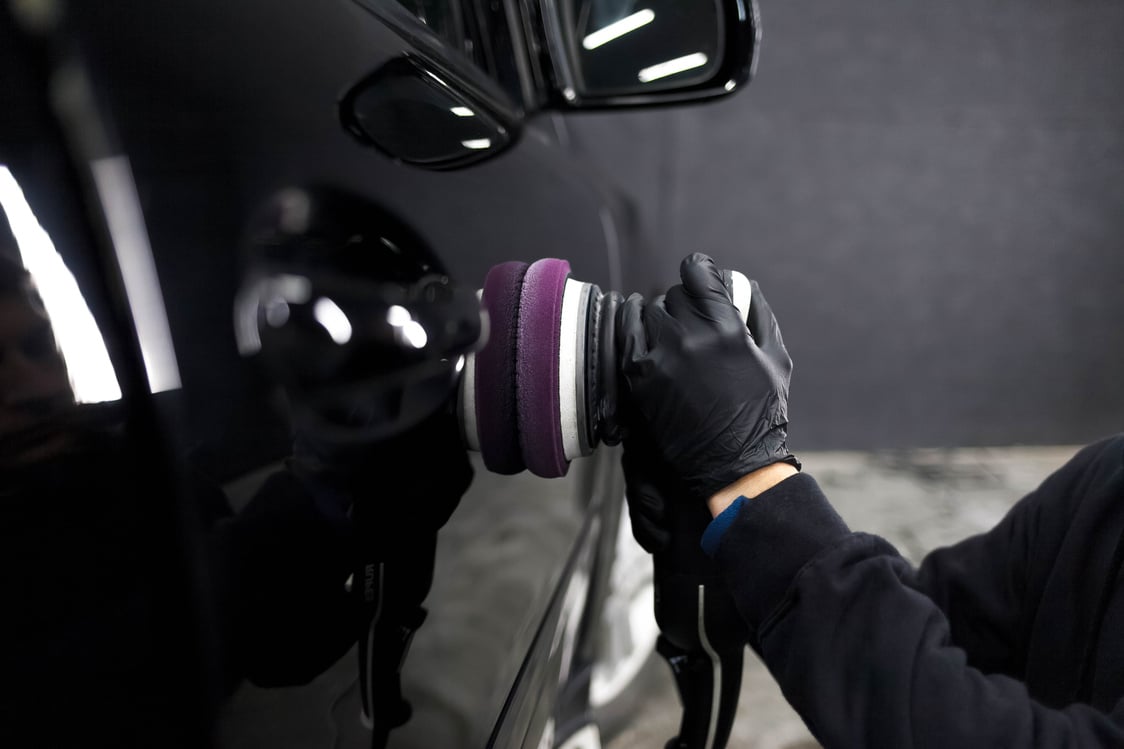 Person Polishing Car Exterior